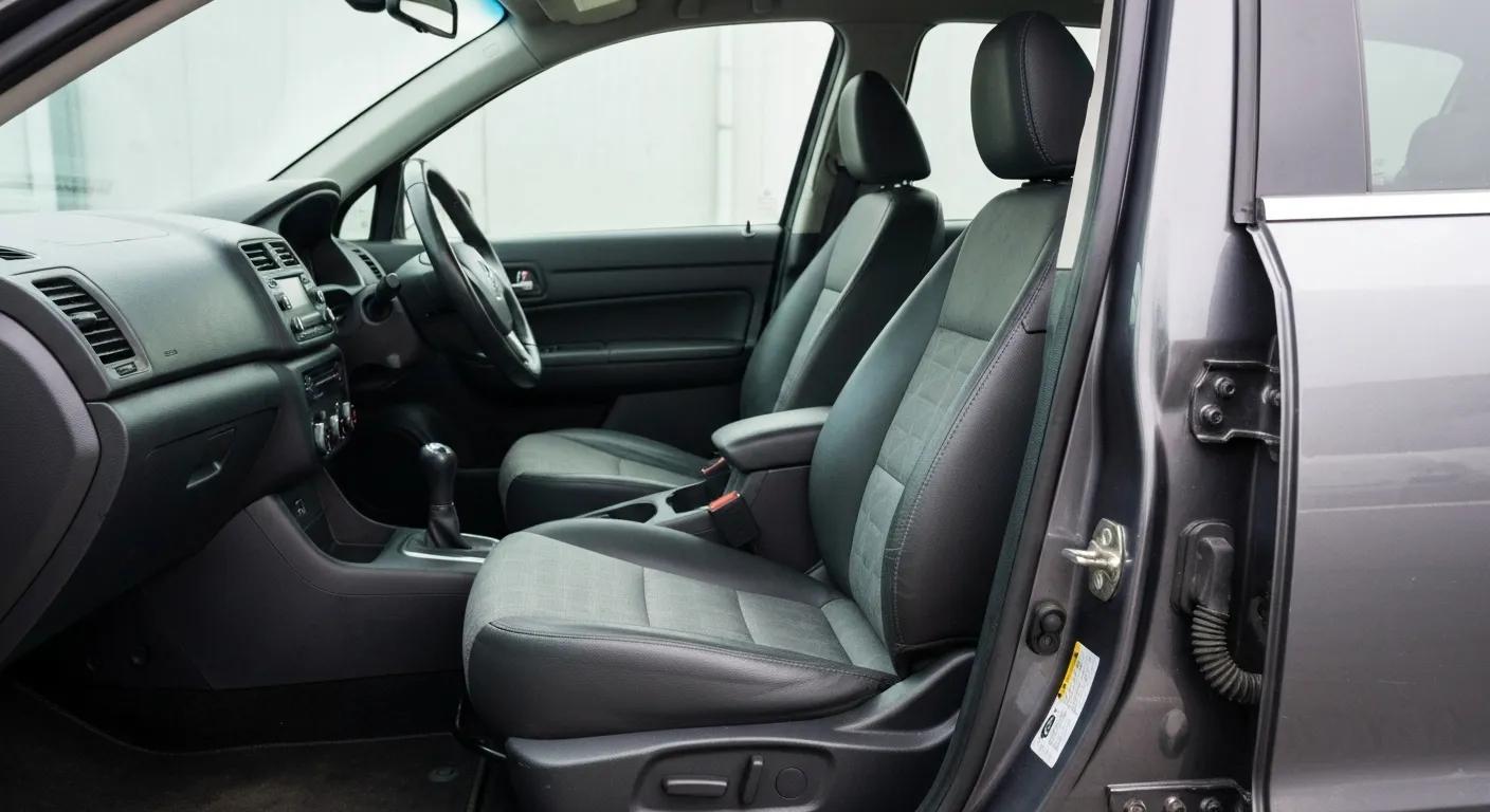 Interior of a prepared rideshare vehicle for inspection, showing clean seatbelts and well-maintained tyres